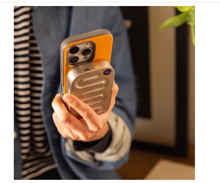 Person holding phone with accessory